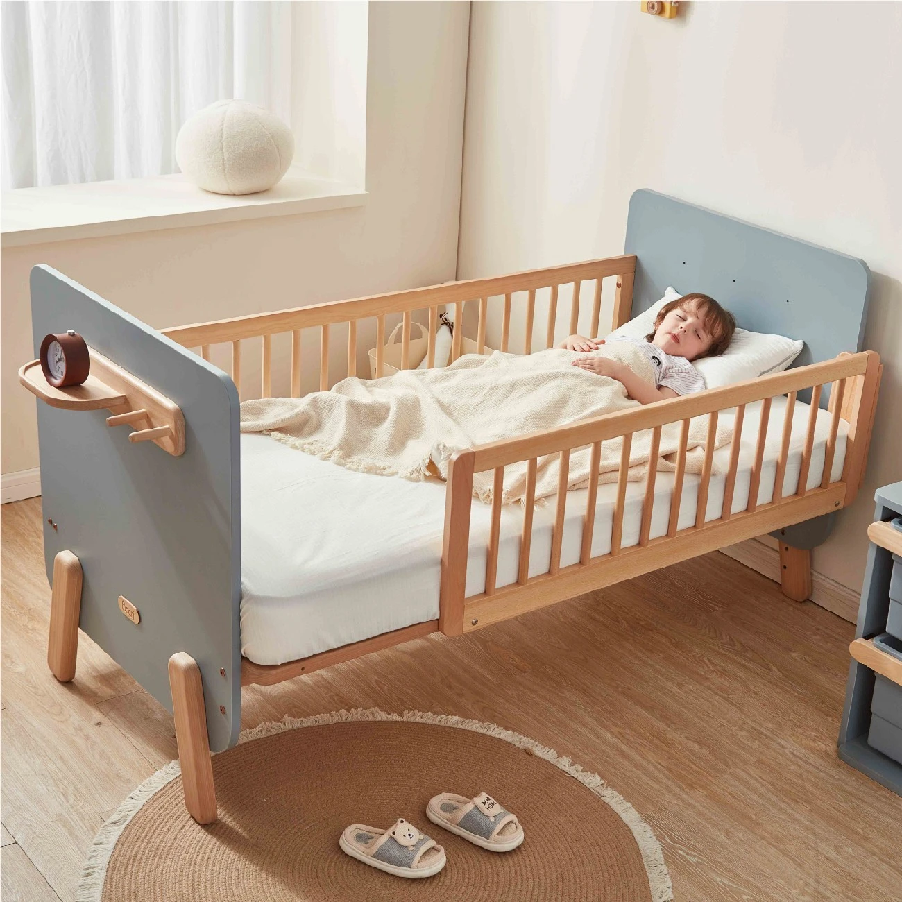 Solid wood toddler single bed with rails and integrated safety guardrails for nursery conversion. Solid wood toddler single bed with rails and integrated safety guardrails for nursery conversion.